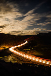 High angle view of light trails on road