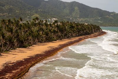 Scenic view of sea against mountains