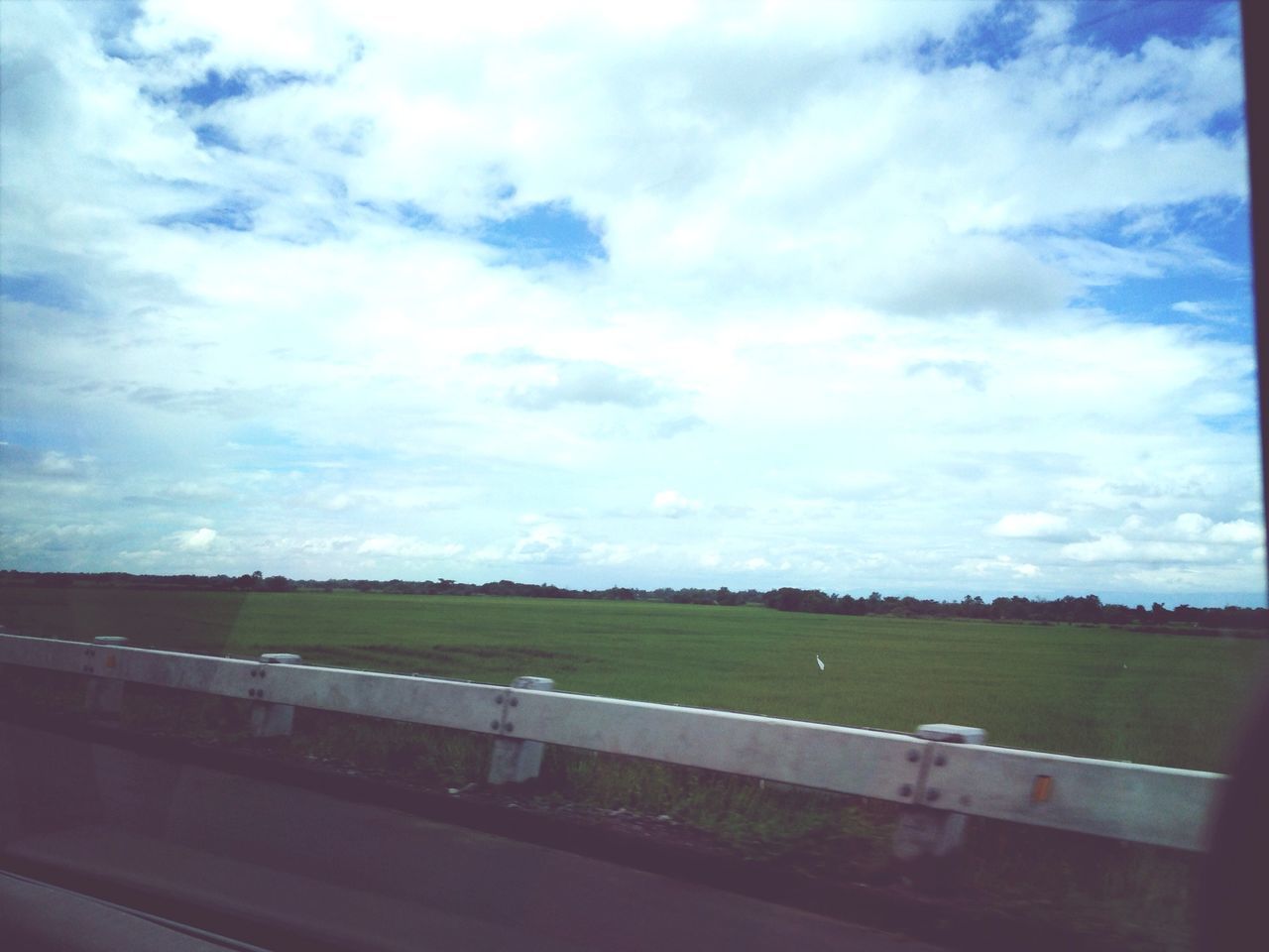 sky, cloud - sky, field, grass, landscape, cloud, transportation, cloudy, fence, road, tranquility, tranquil scene, nature, grassy, scenics, day, rural scene, beauty in nature, no people, outdoors