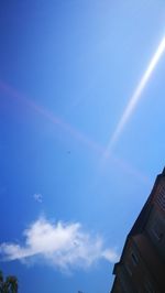 Low angle view of building against blue sky