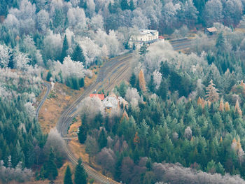 Railway station jedlova, birds view. early winter hoarfrost on treetops. cold, snow and hoarfrost