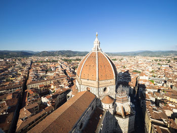 Aerial view of city against clear sky