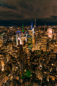 High angle view of illuminated buildings in city