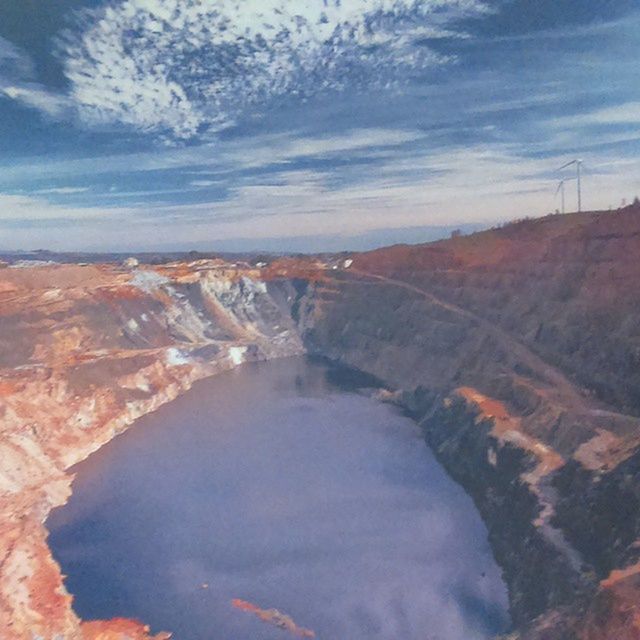 water, sky, scenics, cloud - sky, tranquility, tranquil scene, beauty in nature, nature, reflection, landscape, river, cloud, rock - object, physical geography, idyllic, high angle view, non-urban scene, geology, day, outdoors