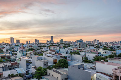 High angle view of buildings against sky during sunset