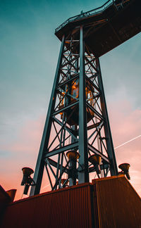 Low angle view of silhouette bridge against sky during sunset