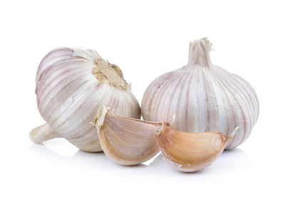 Close-up of garlic against white background