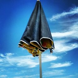 Low angle view of pole against blue sky