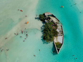 Aerial view of shipwreck on shore in sea