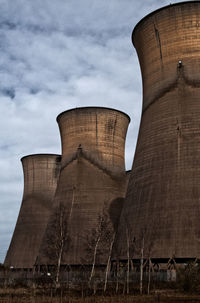 Low angle view of smoke stack against sky