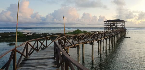 Pier over sea against sky