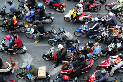 High angle view of people with motorcycles on road