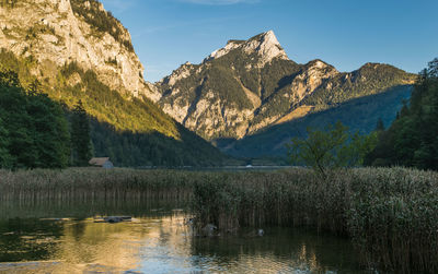 Scenic view of lake with mountains in background