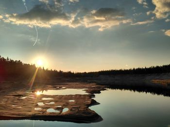 Panoramic view of lake against sky during sunset