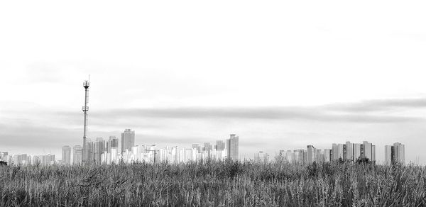 Modern buildings against sky in city