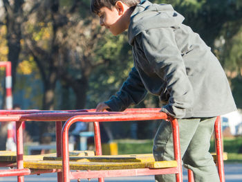 Child playing alone in playground