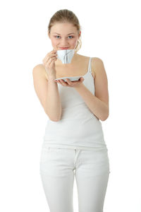 Portrait of woman standing against white background
