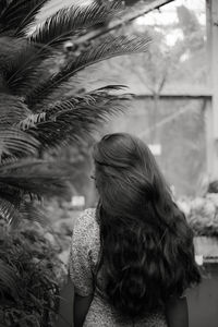 Rear view of a young woman with beautiful long hair