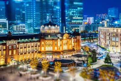 Illuminated buildings in city at night