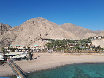 Scenic view of mountains against clear blue sky