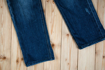 Directly above shot of leather hanging on wood