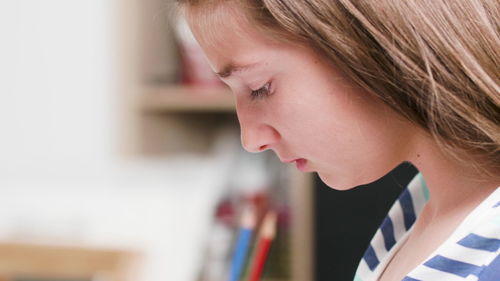 Close-up of young woman looking away