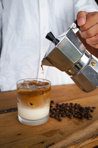 Glass of coffee cup on table