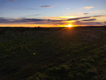 Scenic view of landscape at sunset