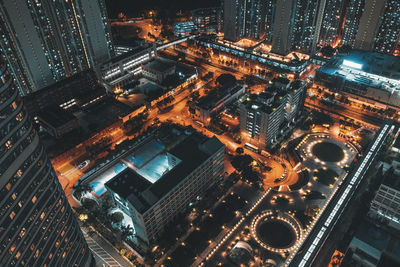 Aerial view of illuminated buildings in city at night