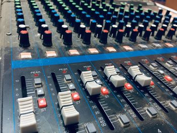 Close-up of sound mixer at recording studio