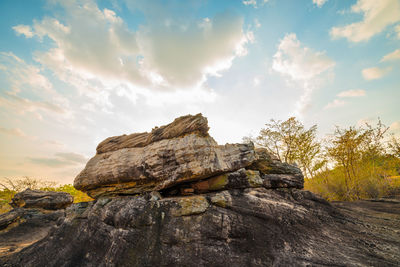 Rock formations on landscape against sky