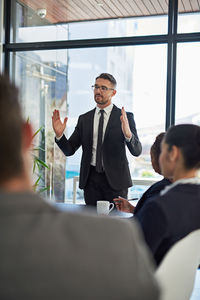 Business colleagues having discussion at office