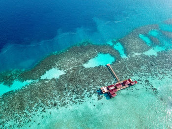 Aerial view of water chalet in egang egang near bum bum island during sunrise.