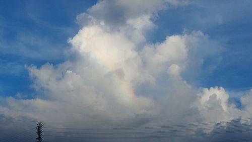 Low angle view of electricity pylon against sky