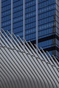 Low angle view of modern building against sky in city