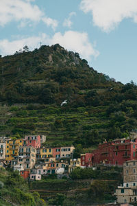 Buildings in town against sky