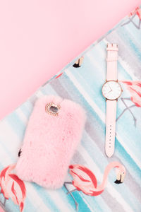 High angle view of pink umbrella on bed