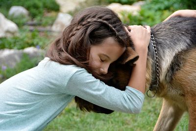 Side view of woman with dog