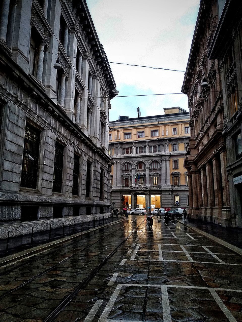 STREET AMIDST BUILDINGS IN CITY