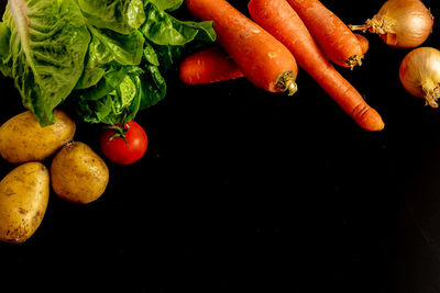 Close-up of oranges against black background