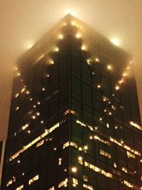 Low angle view of illuminated building at night