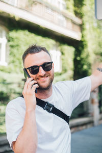 Portrait of young man using mobile phone