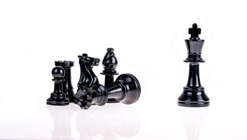 Digital composite image of chess pieces against white background