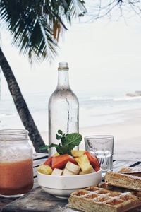 Fruits on table at beach
