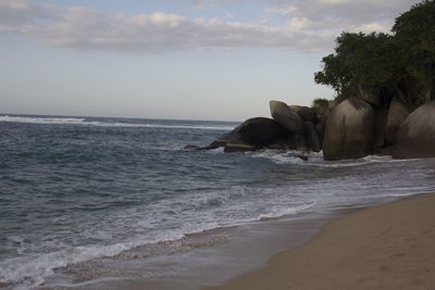 Scenic view of sea against cloudy sky