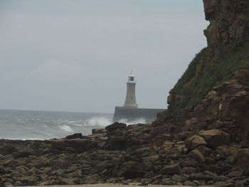 Lighthouse on cliff at seaside