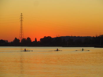 Scenic view of sea against orange sky