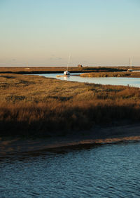 Scenic view of sea against clear sky during sunset