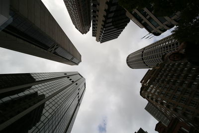 Low angle view of buildings against sky in city