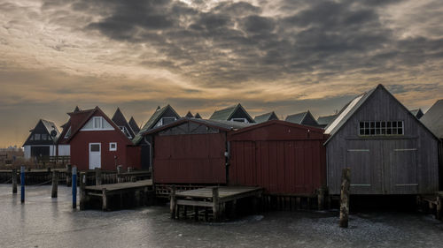 View of boat house against sky during sunset